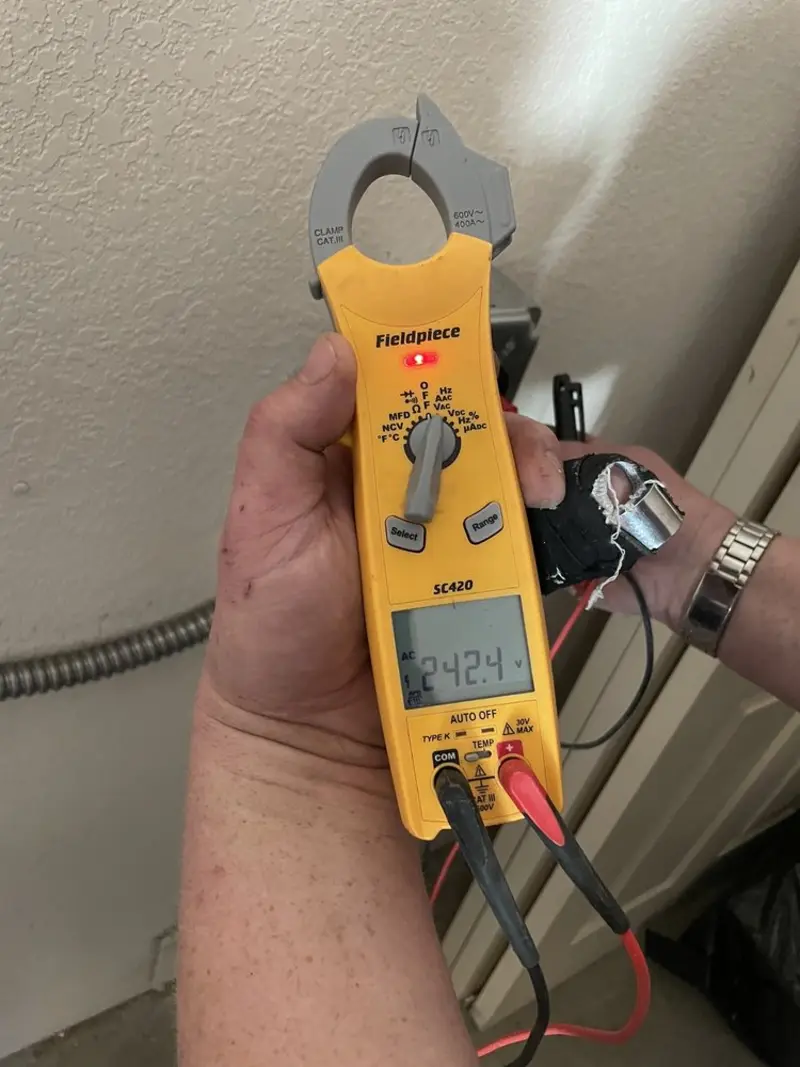 Voltage testing with clamp meter during Circuit Breaker Repair in Wolfforth